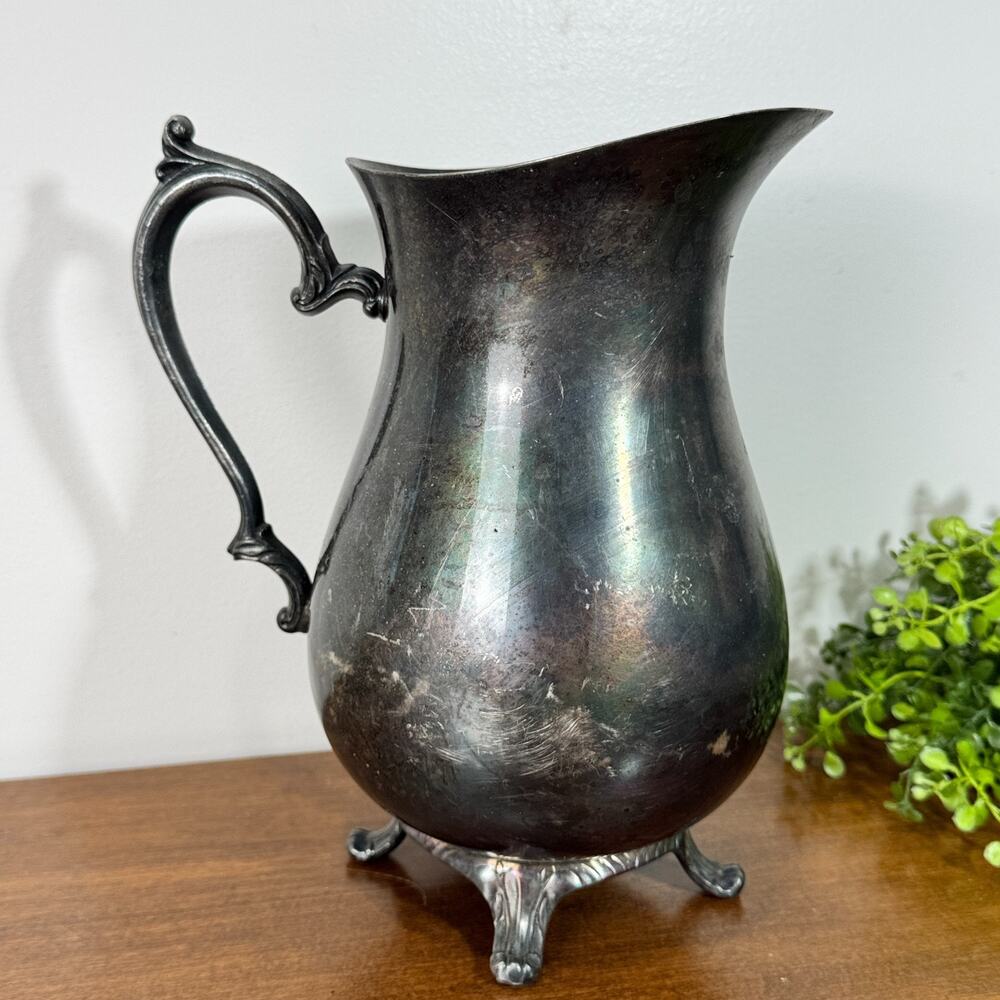 International Silver Company Footed Water Pitcher with Ice Catch 9.25" Ornate